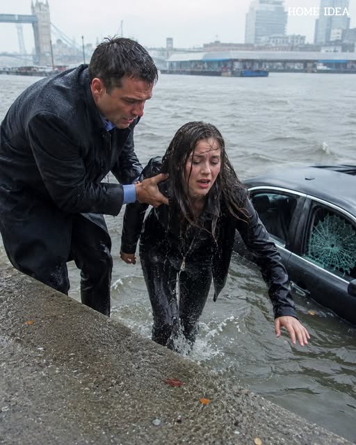 A hand plunged through the dark water and locked around her wrist.